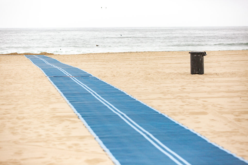 Access mat stretching across the sand at Venice Beach