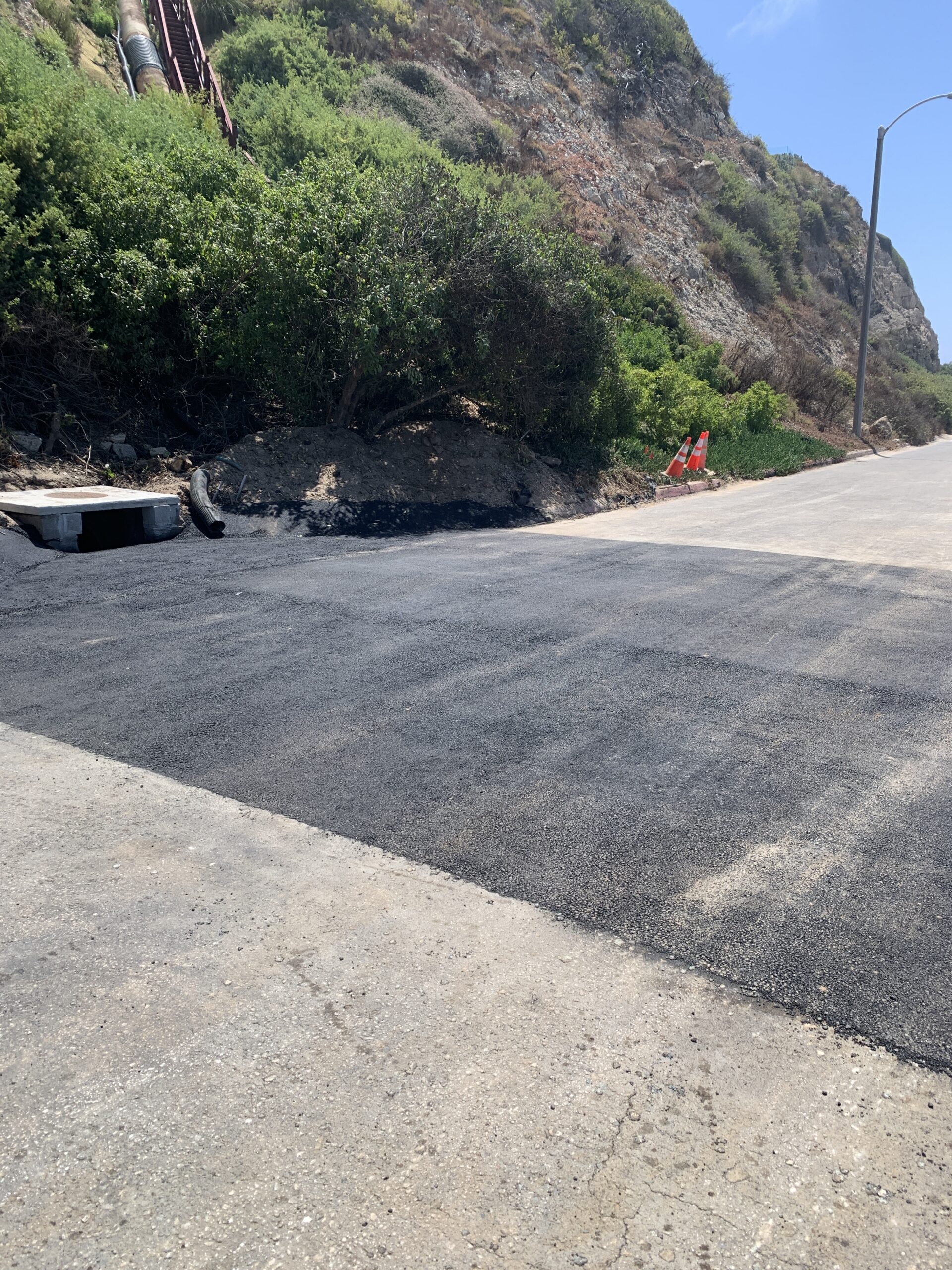 Newly paved section of Westward Beach Road near Point Dume Beach following roadway and storm drain improvements.